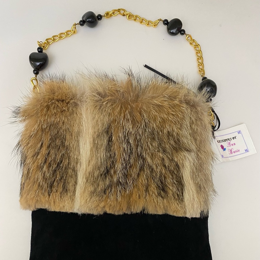 Exclusives by Ann Marie coyote fur and black suede